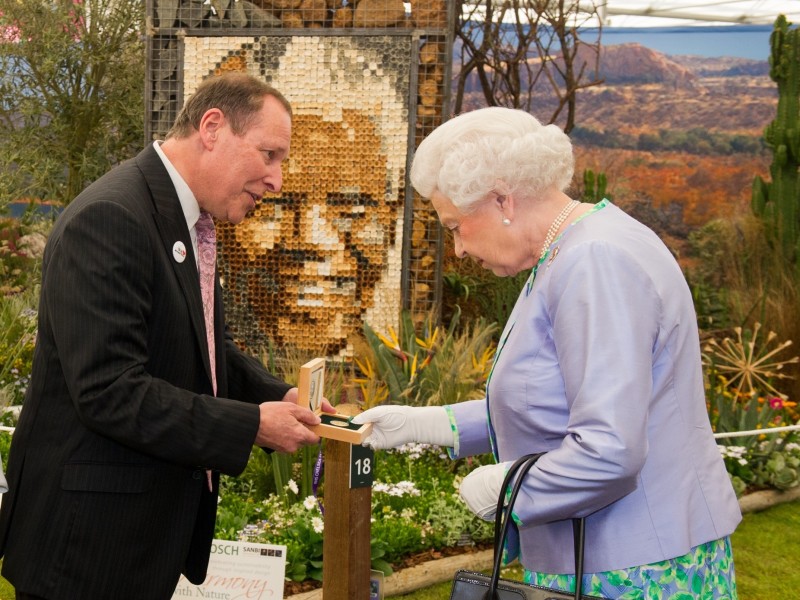 Copyright image 2014©. HM The Queen (R ), meets Lihle Diamini (L) South African National Biodiversity Instltute and Alan Demby, (C) Executive Chairman, The South African Gold Coin Exchange. Her Majesty was given a gold Nelson Mandela medallion, the proceeds of the sale goes to the Nobel Laururete Program and the Mandela Foundation. For further info please contact David Stoch +4420 8563 0182. For photographic enquiries please call Anthony Upton 07973 830 517 or email info@anthonyupton.com This image is copyright Anthony Upton 2014©. This image has been supplied by Anthony Upton and must be credited Anthony Upton. The author is asserting his full Moral rights in relation to the publication of this image. All rights reserved. Rights for onward transmission of any image or file is not granted or implied. Changing or deleting Copyright information is illegal as specified in the Copyright, Design and Patents Act 1988.