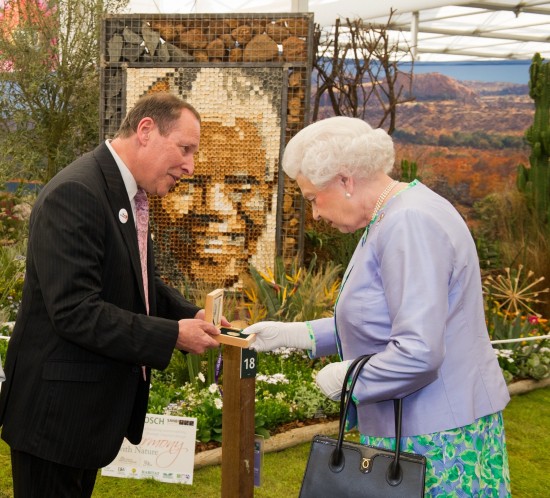 Copyright image 2014©. HM The Queen (R ), meets Lihle Diamini (L) South African National Biodiversity Instltute and Alan Demby, (C) Executive Chairman, The South African Gold Coin Exchange. Her Majesty was given a gold Nelson Mandela medallion, the proceeds of the sale goes to the Nobel Laururete Program and the Mandela Foundation. For further info please contact David Stoch +4420 8563 0182. For photographic enquiries please call Anthony Upton 07973 830 517 or email info@anthonyupton.com This image is copyright Anthony Upton 2014©. This image has been supplied by Anthony Upton and must be credited Anthony Upton. The author is asserting his full Moral rights in relation to the publication of this image. All rights reserved. Rights for onward transmission of any image or file is not granted or implied. Changing or deleting Copyright information is illegal as specified in the Copyright, Design and Patents Act 1988.
